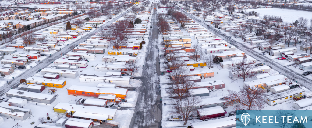 Aerial view of a mobile home park in the snow.