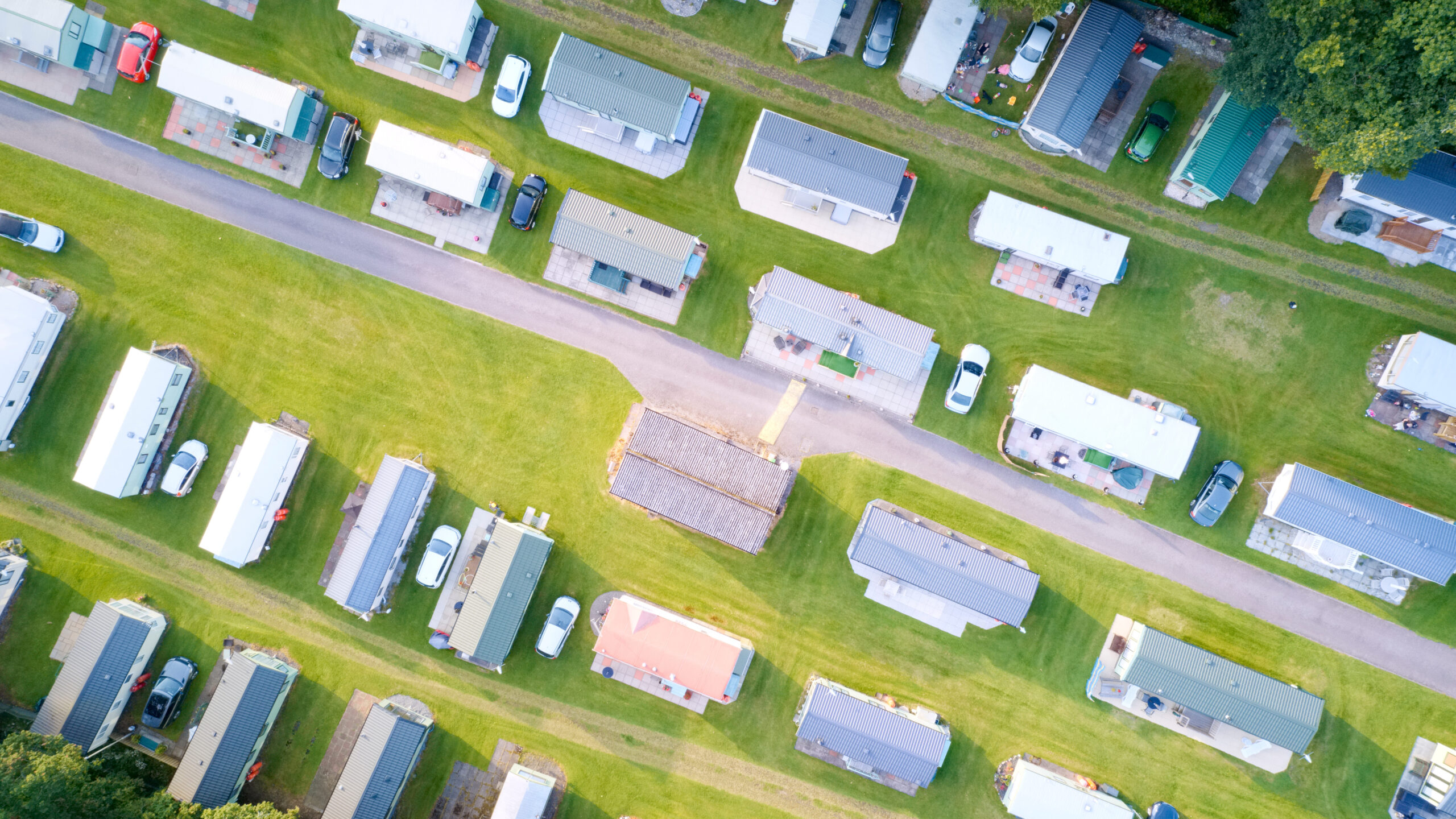Caravan site park aerial view illuminated by summer sun