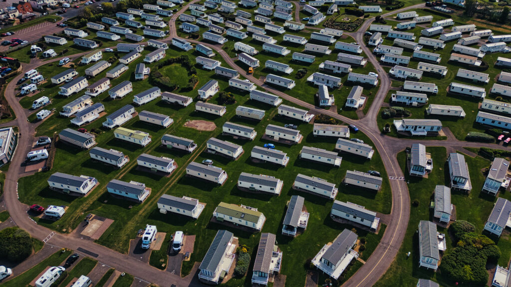 Aerial View of Mobile Home Park with Rows of Trailers in Seahouses village, UK.