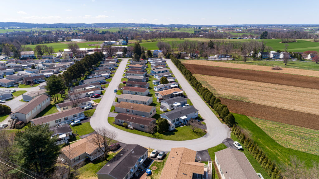 Aerial View of a Mobile, Modulator, Prefab Home Park, in the Middle of Rural America, with Plowed Fields Next to it